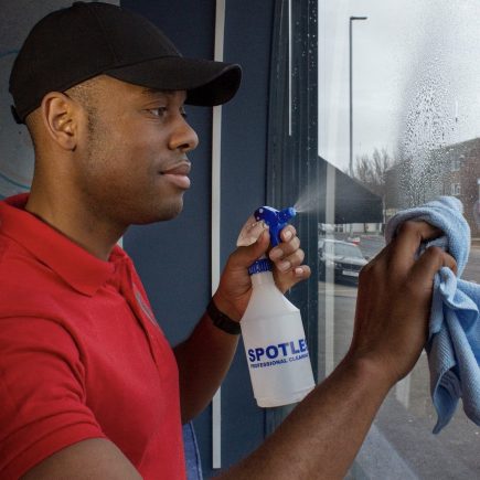 window cleaner shows attention to detail using a lint free cloth to make touch ups.